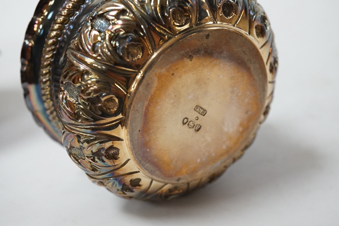 A George III engraved silver oval teapot, by John Eames, London, 1803, together with an early Victorian engraved silver milk jug, Edward Barton, London, 1837 and a late Victorian embossed silver sugar bowl by Josiah Will